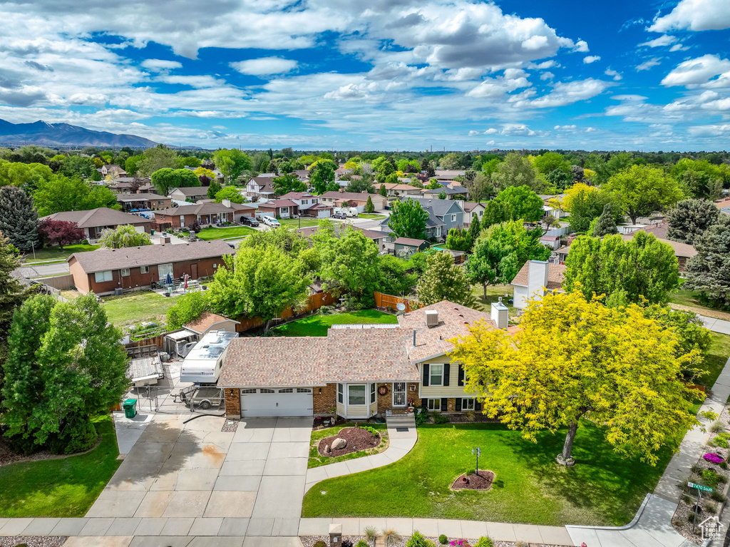 Aerial view of residential area featuring a mountain backdrop
