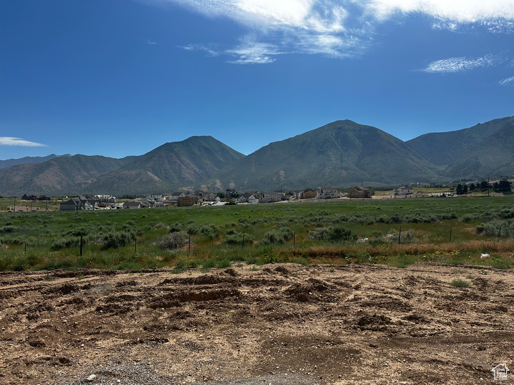 View of mountain backdrop featuring rural landscape