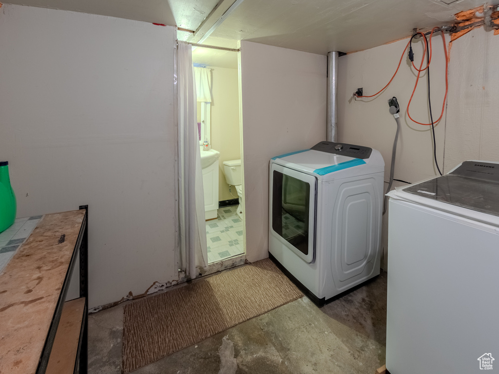 Washroom featuring separate washer and dryer