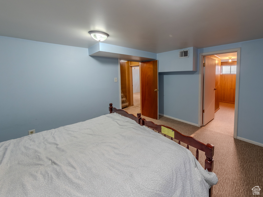 Carpeted bedroom featuring baseboards