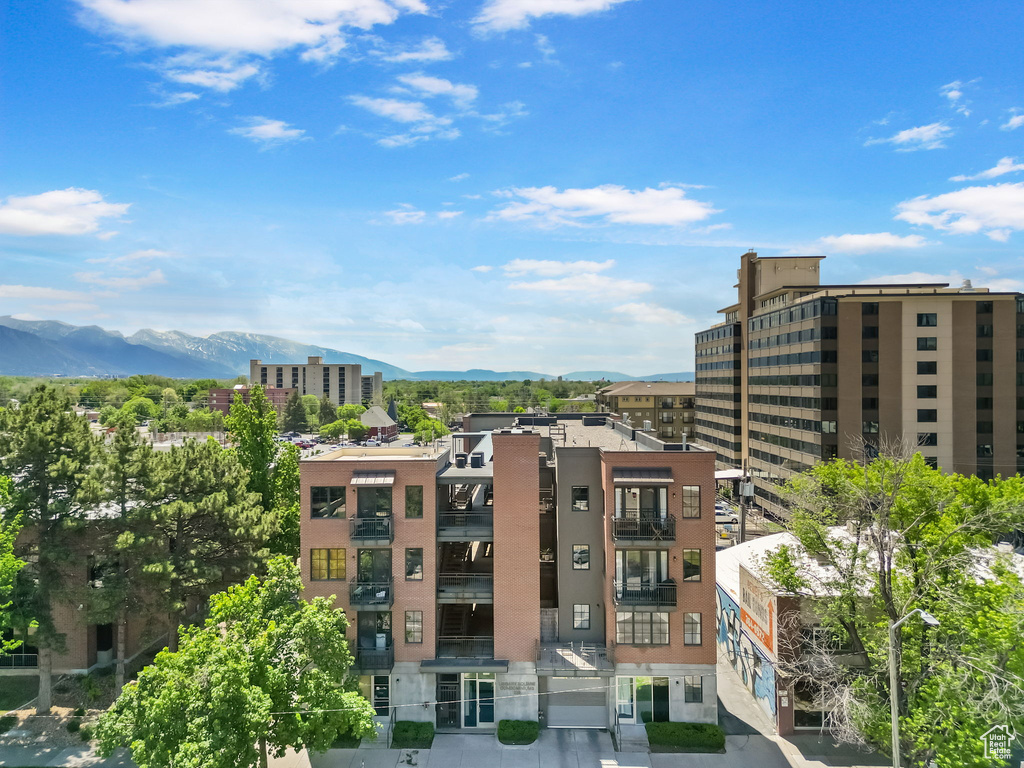 View of apartment building / complex featuring a mountain view
