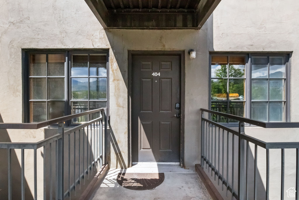 Property entrance with stucco siding