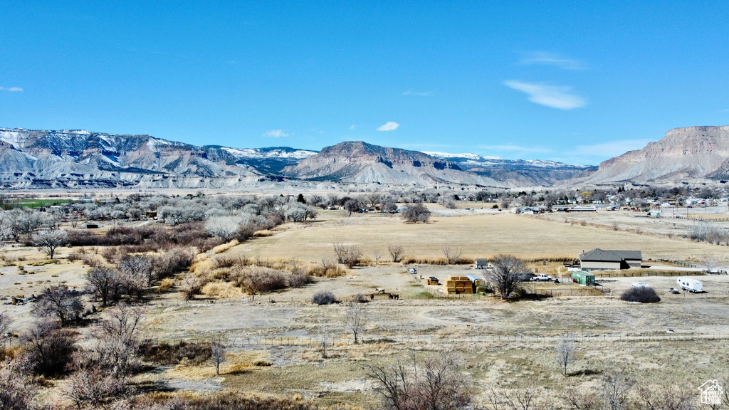 View of mountain background featuring rural landscape