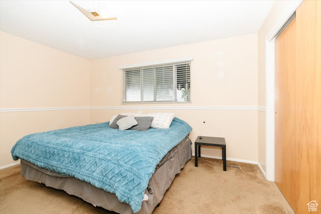 Carpeted bedroom with baseboards
