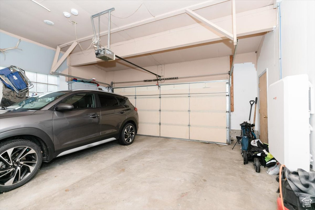 Garage featuring a garage door opener