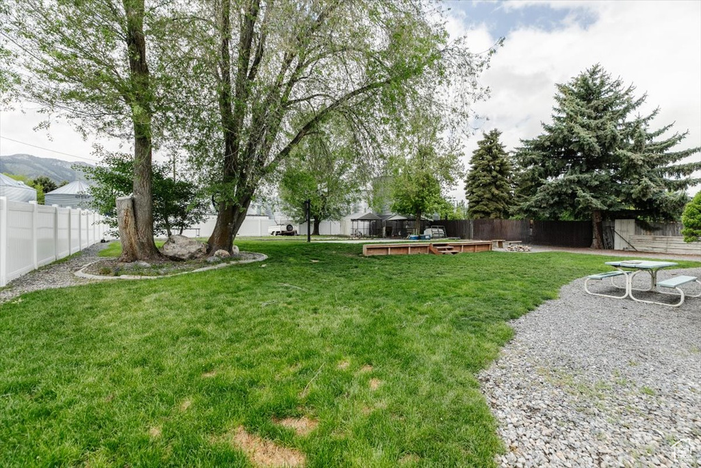 View of yard with a deck