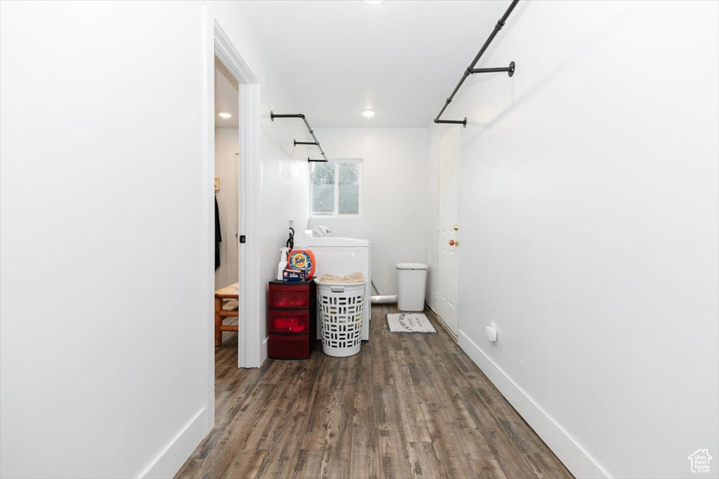 Bathroom with wood finished floors, baseboards, a sink, a shower, and recessed lighting