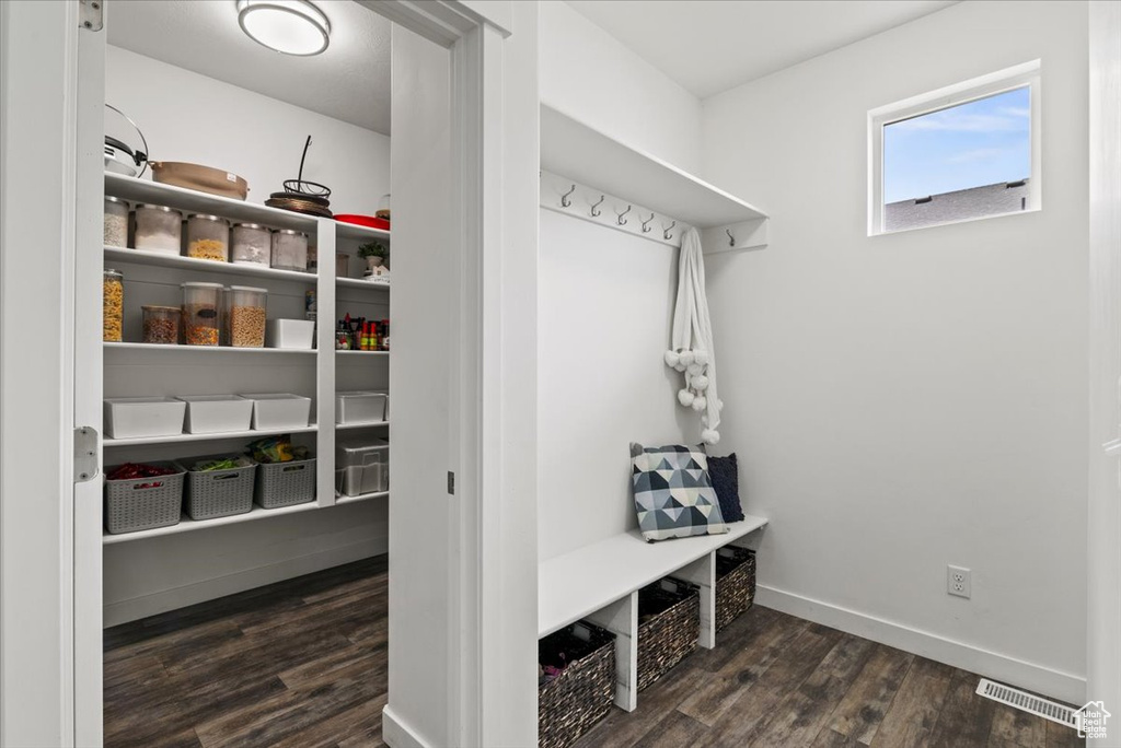 Mudroom featuring wood finished floors and baseboards