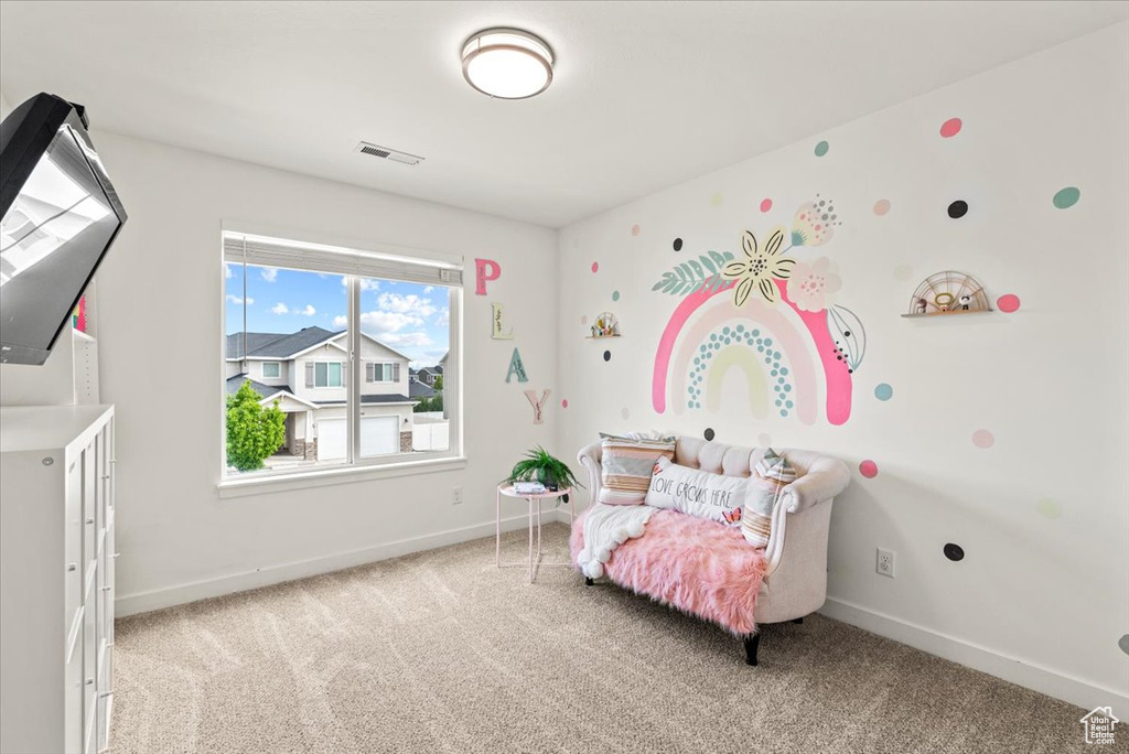 Carpeted bedroom with baseboards