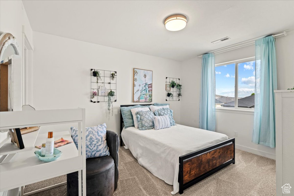 Bedroom with carpet flooring