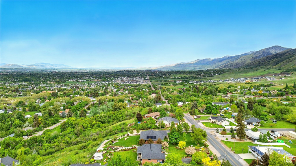 Aerial perspective of suburban area featuring a mountain backdrop
