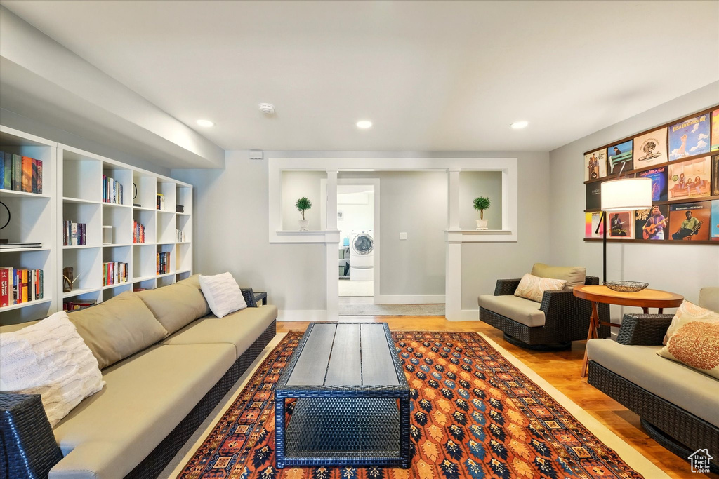 Living room featuring wood finished floors, recessed lighting, and baseboards