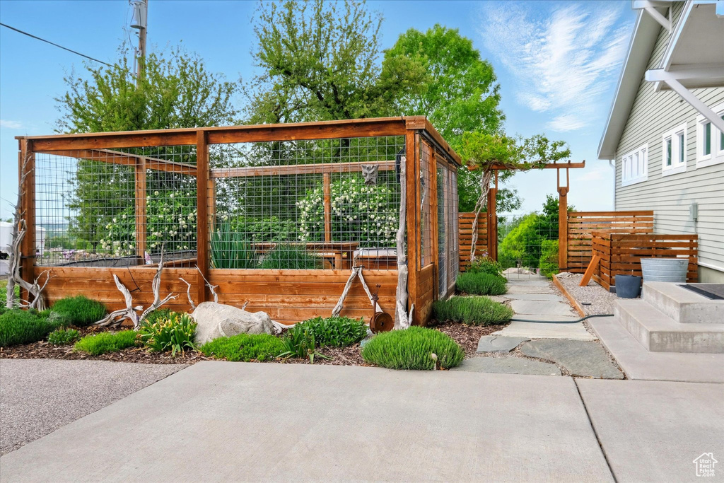 View of patio with a garden