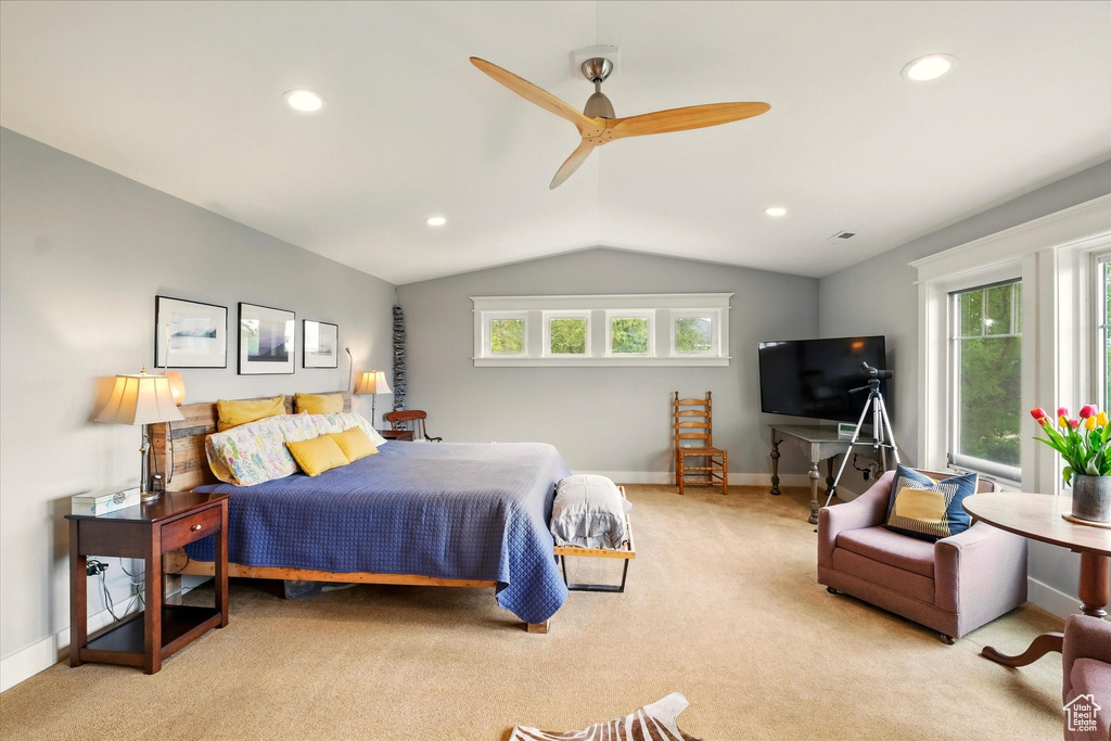 Carpeted bedroom featuring lofted ceiling, baseboards, recessed lighting, and a ceiling fan