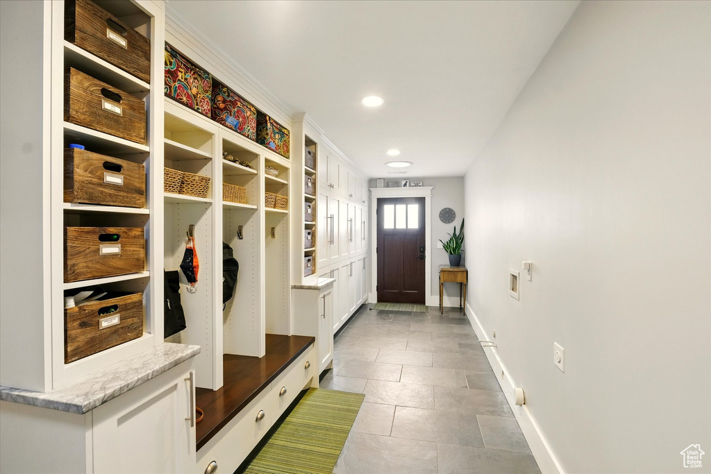 Mudroom with baseboards, tile patterned floors, and recessed lighting