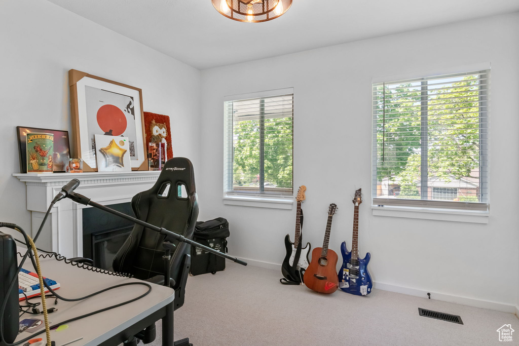 Miscellaneous room with carpet flooring and baseboards