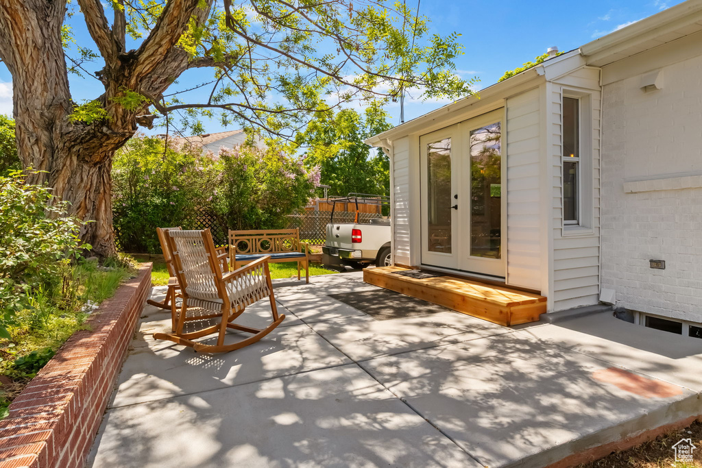 View of patio / terrace with french doors and fence