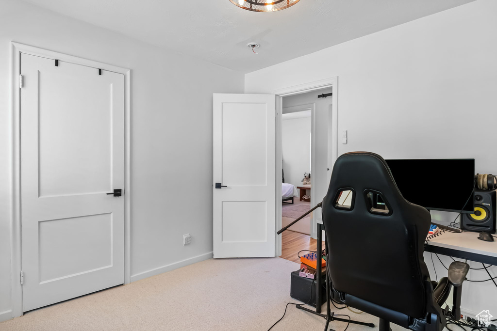 Office space featuring carpet and baseboards