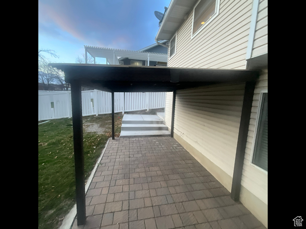 View of patio with fence