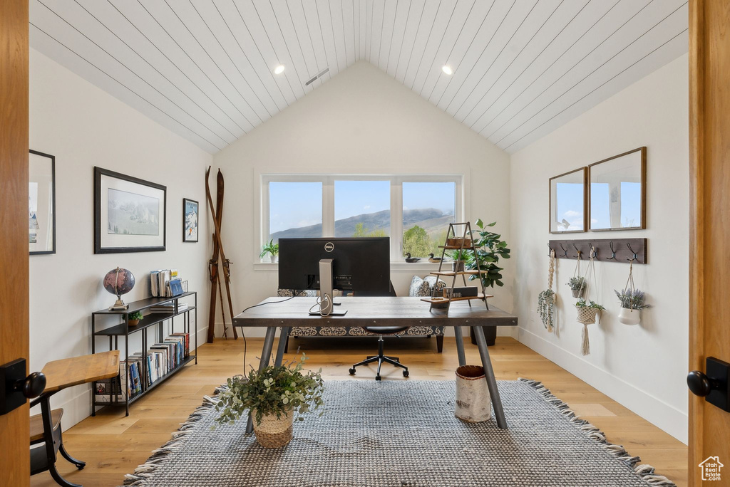 Office area with lofted ceiling, light wood-type flooring, recessed lighting, and baseboards