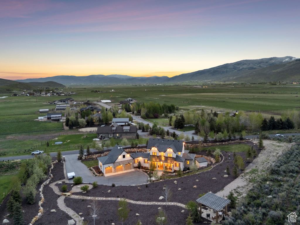Aerial view at dusk of a mountain view and a rural view