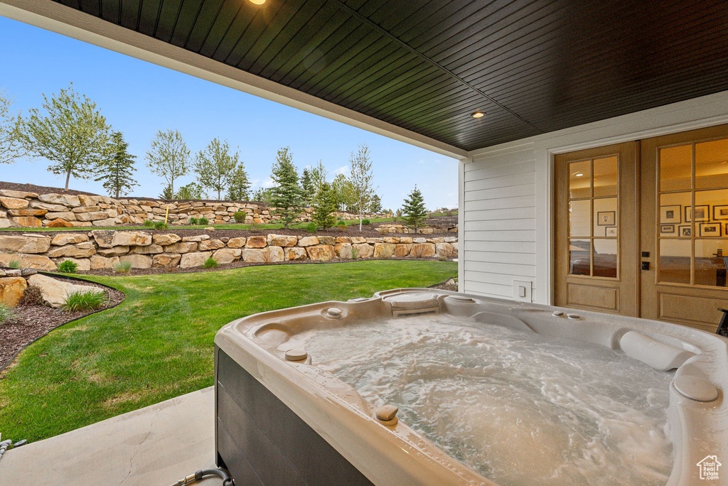 View of patio featuring a hot tub