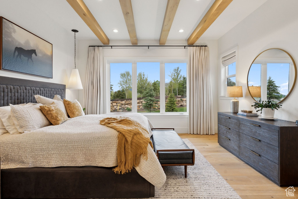 Bedroom with beam ceiling, light wood-type flooring, and recessed lighting