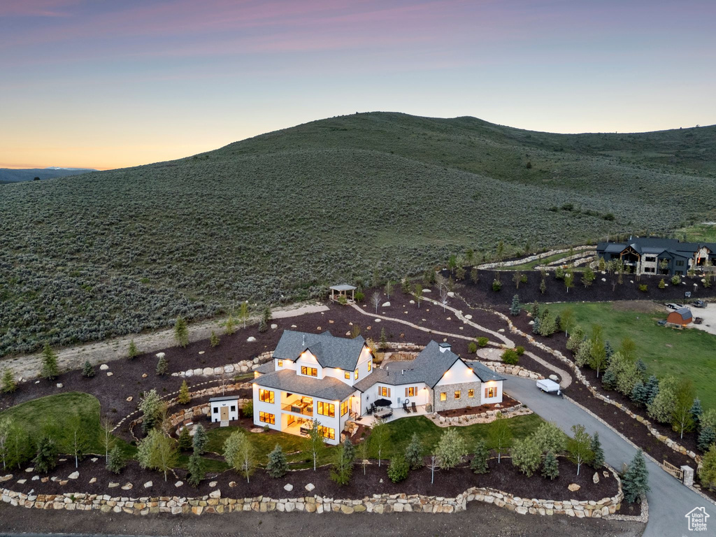 Aerial overview of property's location featuring a mountainous background