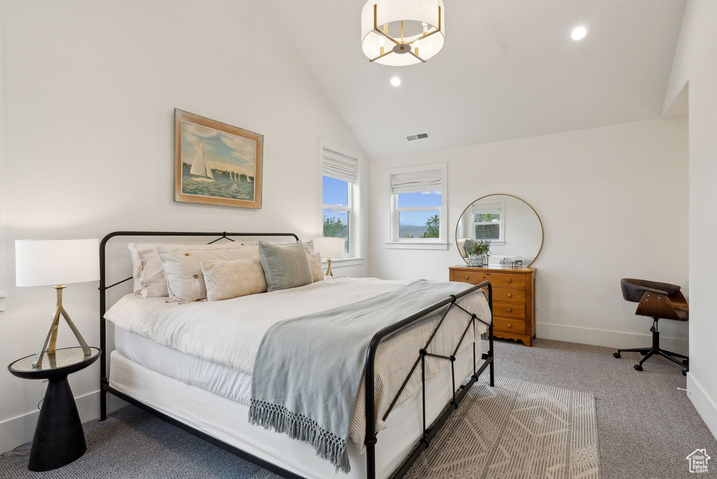 Carpeted bedroom featuring vaulted ceiling, baseboards, and recessed lighting