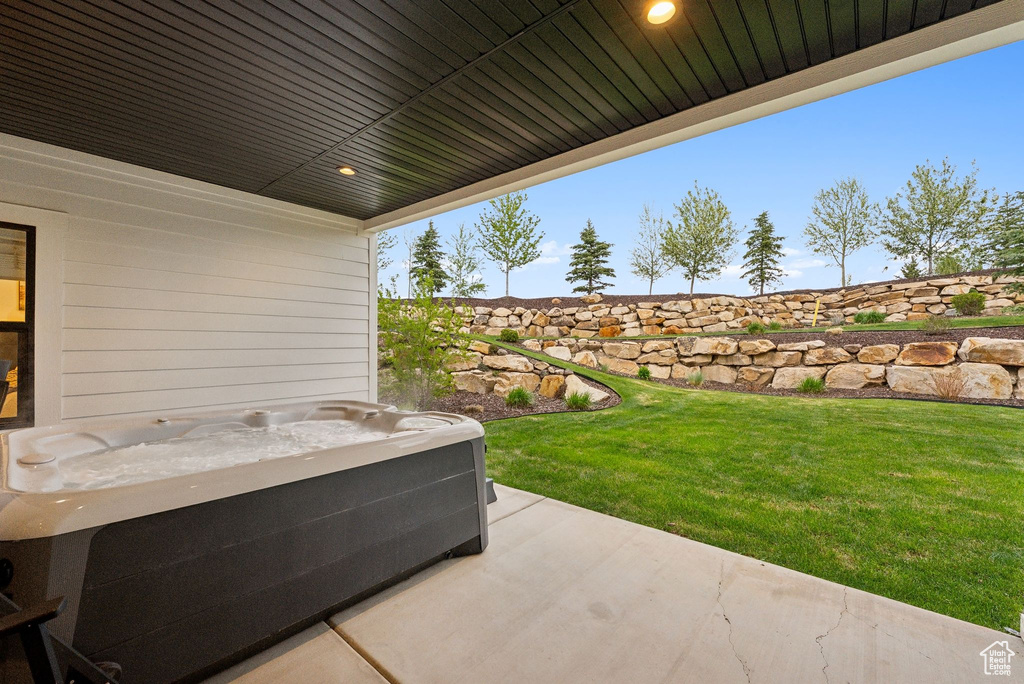 View of patio / terrace featuring a hot tub