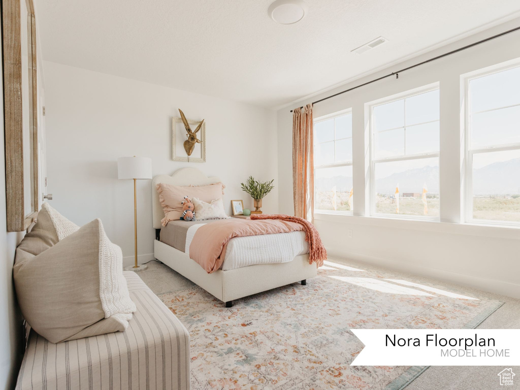 Carpeted bedroom featuring baseboards