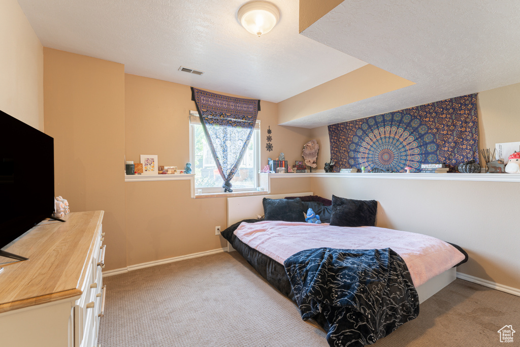 Carpeted bedroom with baseboards