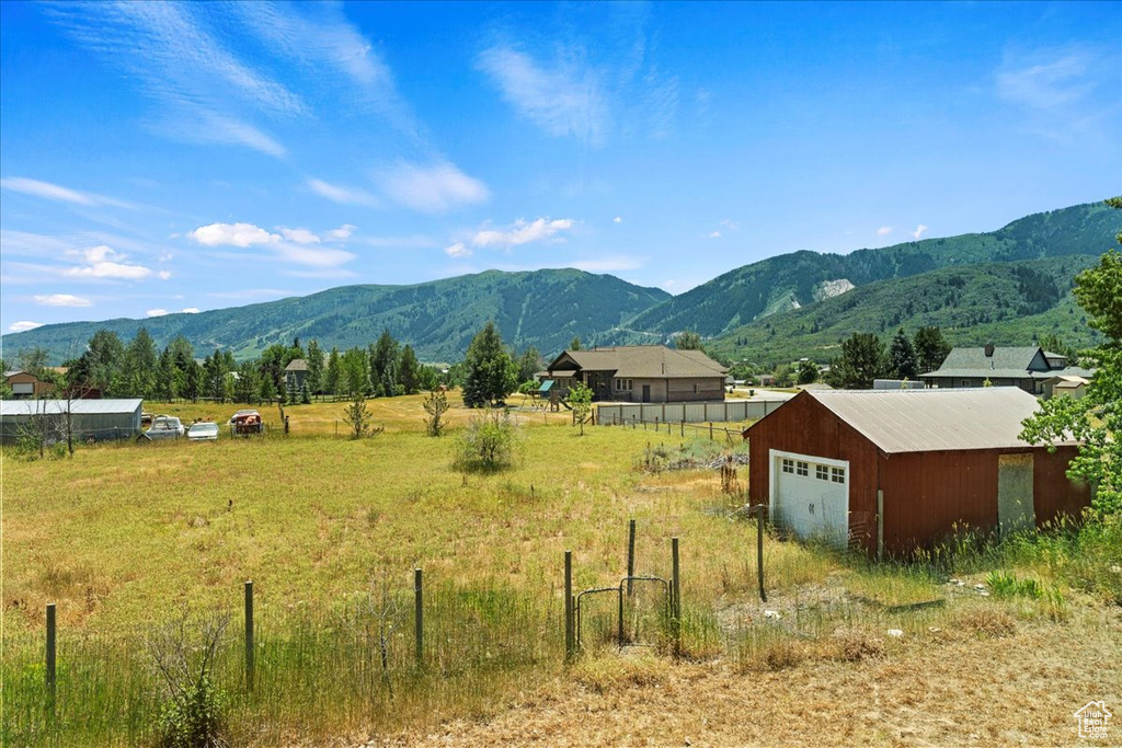 View of mountain backdrop featuring rural landscape