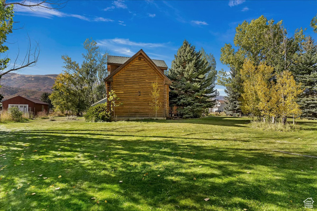 View of grassy yard featuring a mountain view