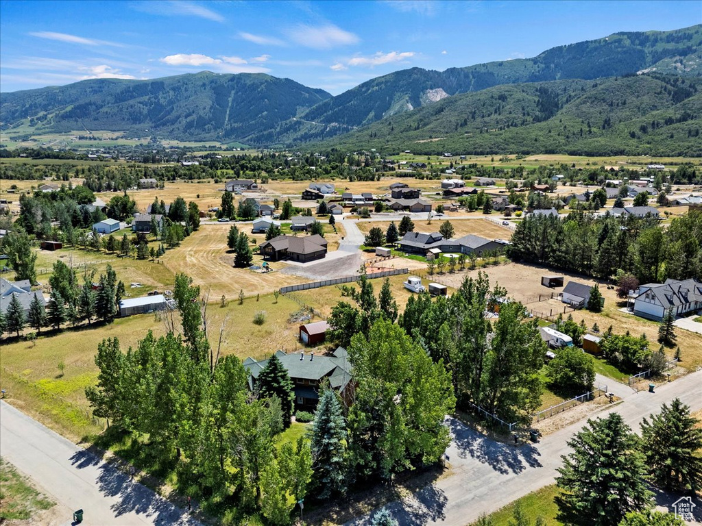Aerial perspective of suburban area with a mountainous background