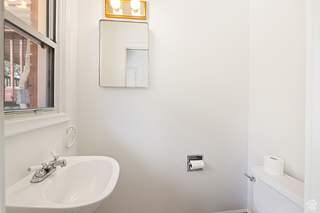 Bathroom featuring a sink and toilet
