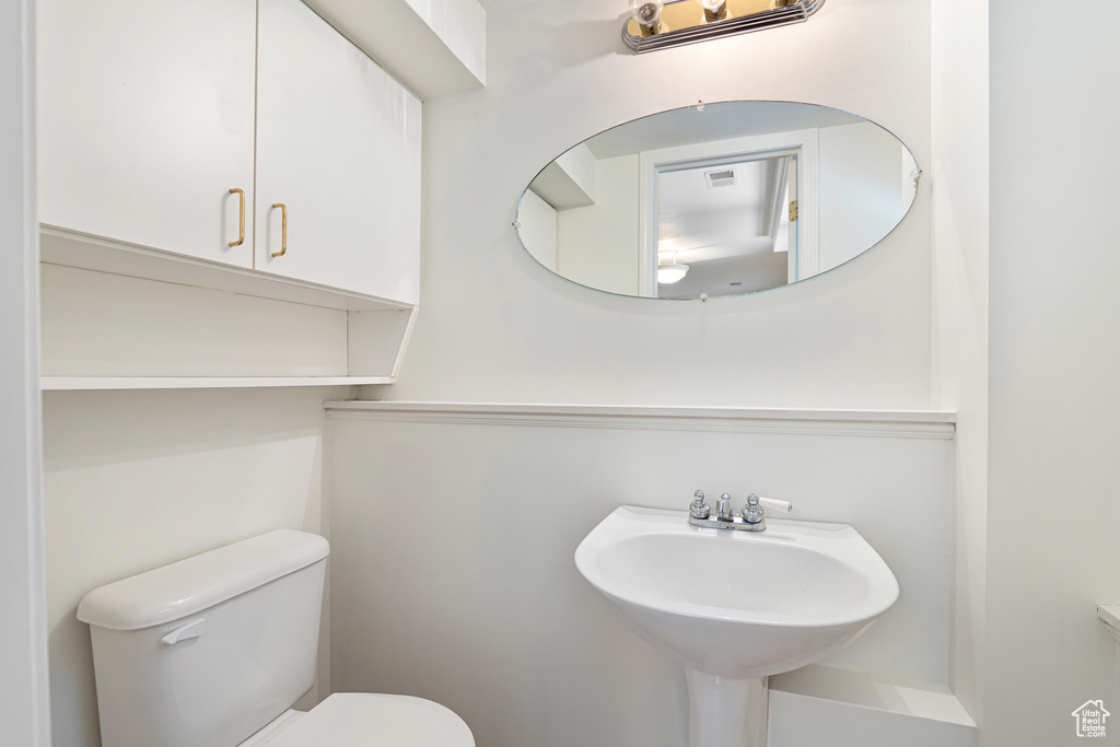 Bathroom with toilet and a sink