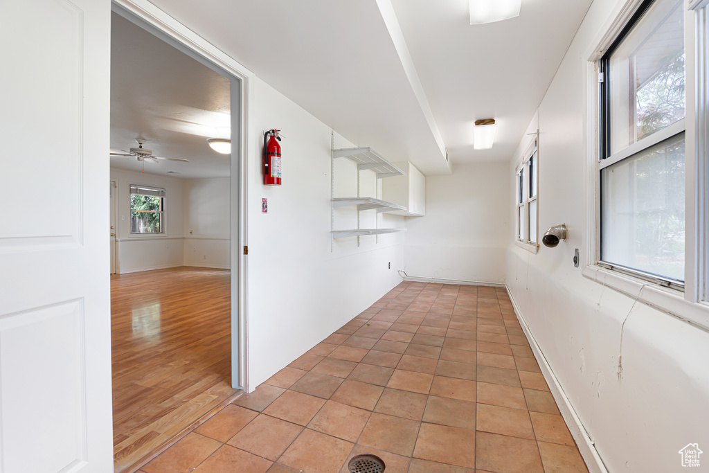 Hallway featuring baseboards