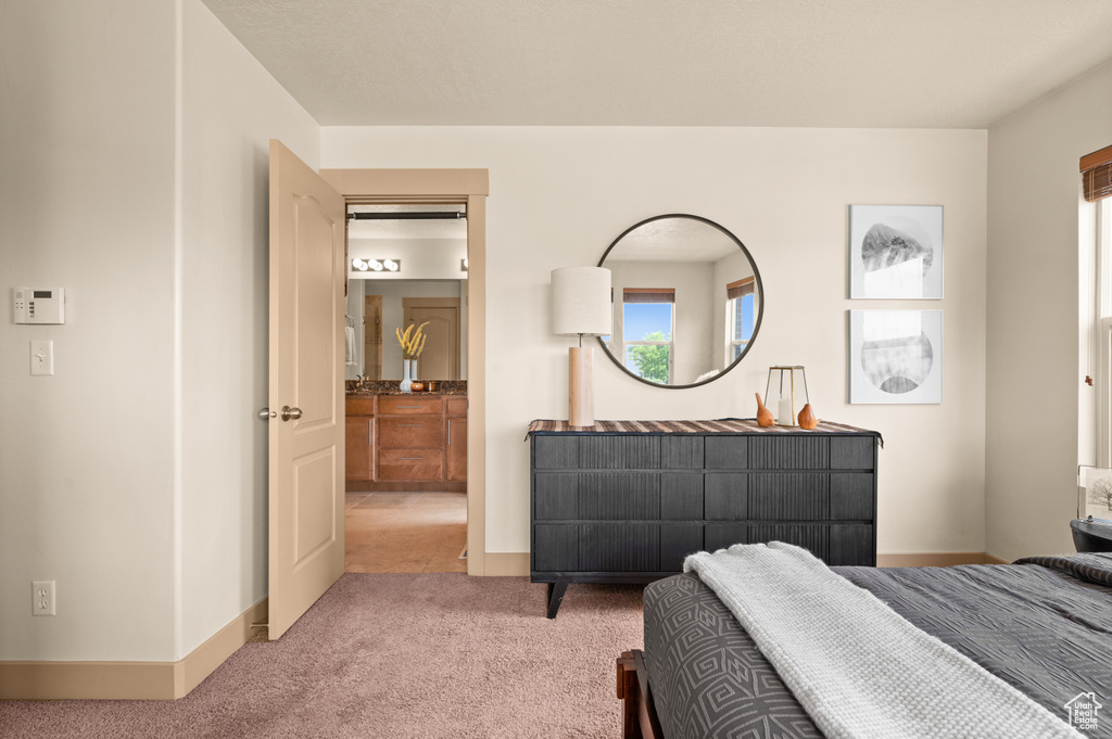 Bedroom with carpet and baseboards