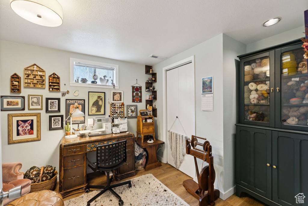 Home office with wood finished floors