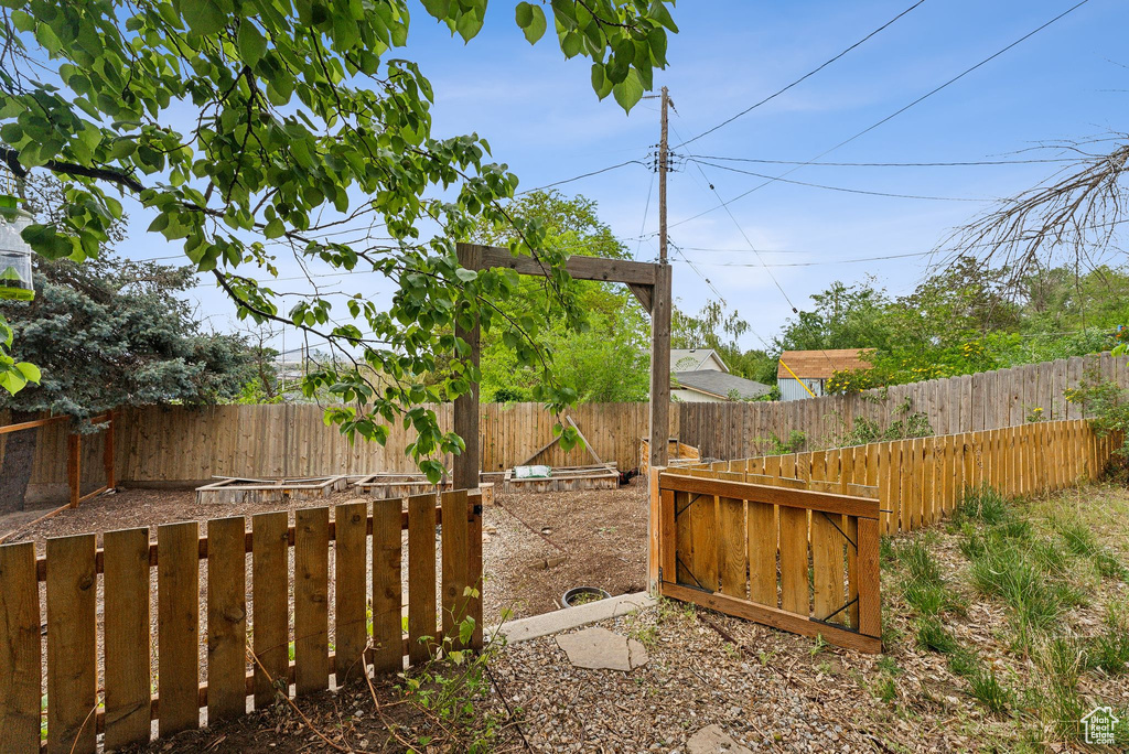 View of fenced backyard