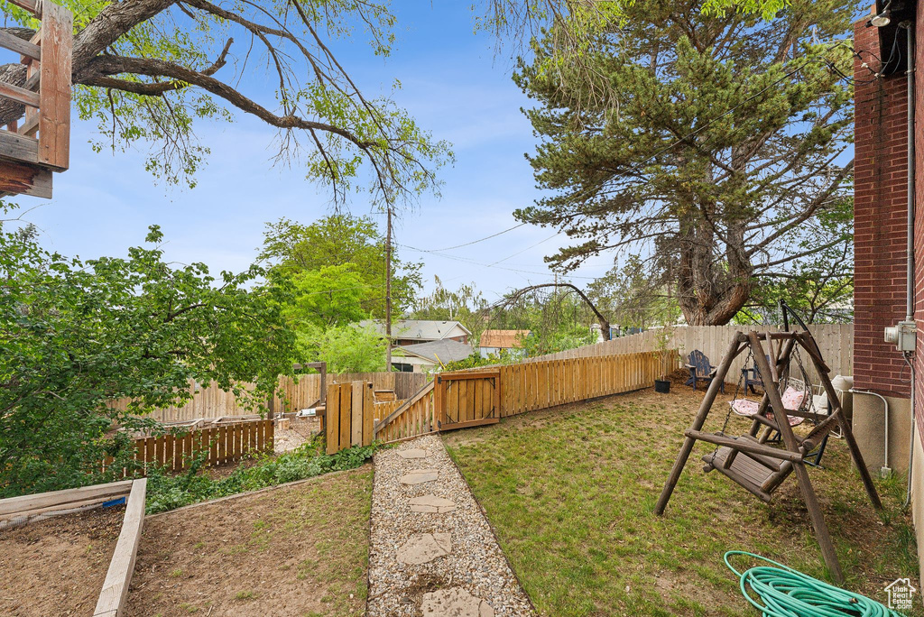 View of yard with a gate