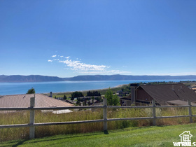 View of yard featuring a water and mountain view