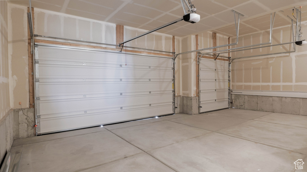 Garage featuring a garage door opener