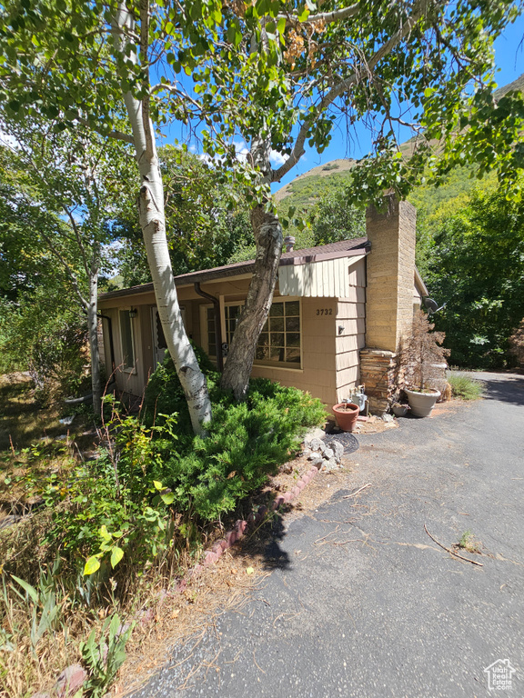 View of front of property with a chimney