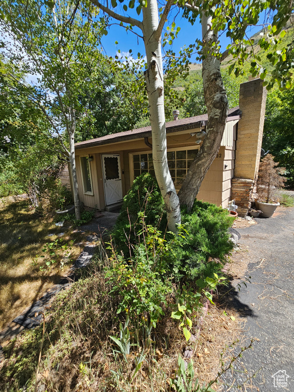 View of front of property featuring a chimney