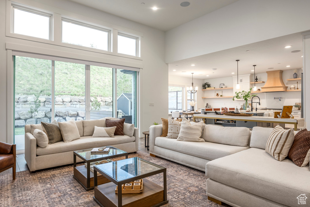 Living room with recessed lighting and a high ceiling