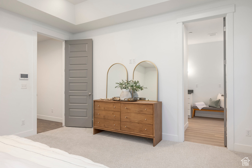 Carpeted bedroom featuring baseboards