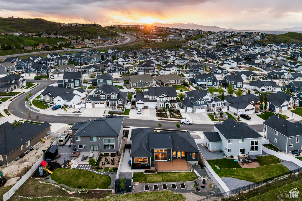 Aerial view at dusk of a residential view and a mountain view
