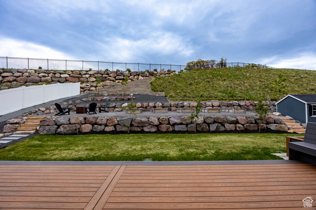 View of yard with a fire pit and a wooden deck